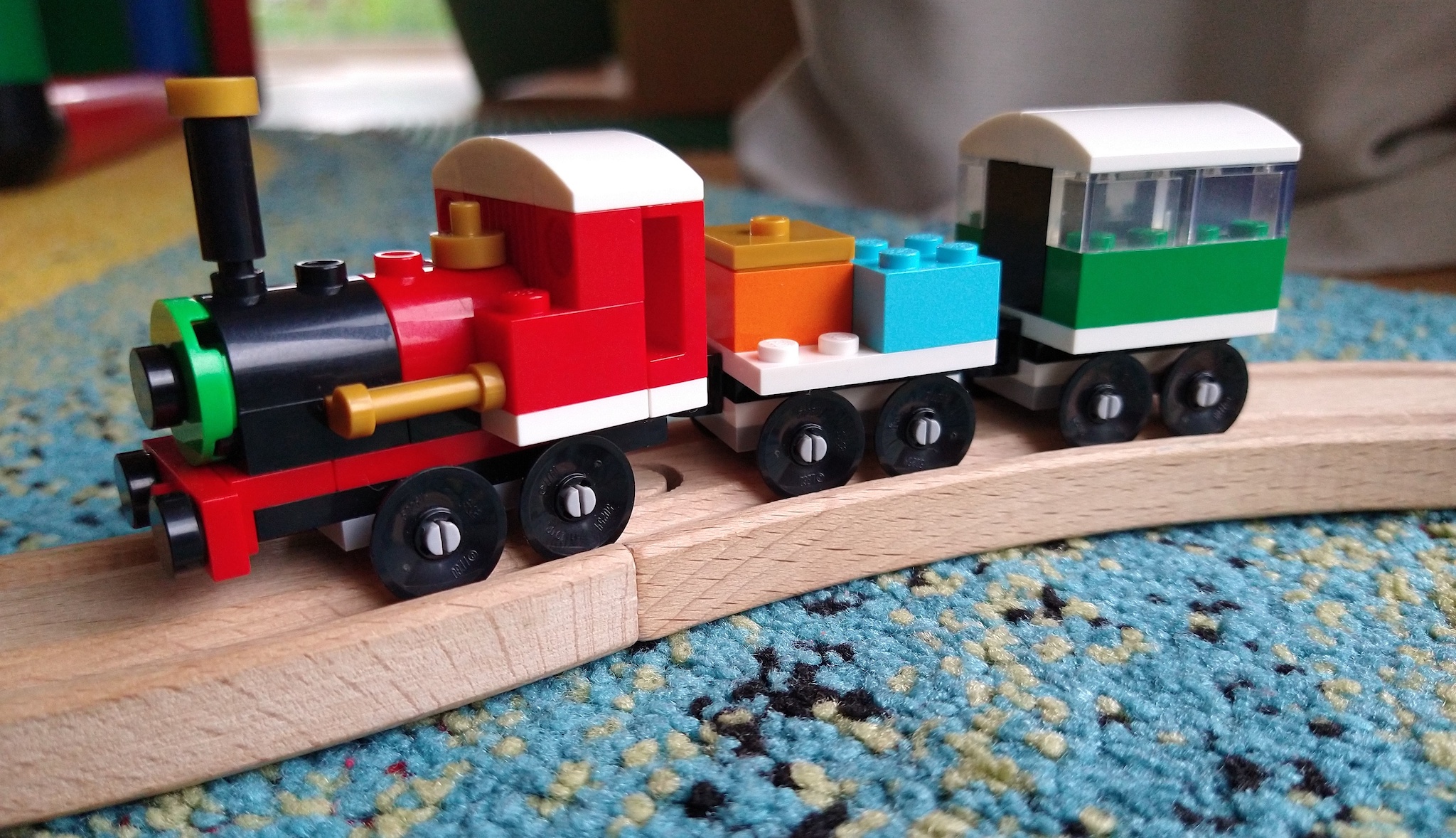 Lego train running on Brio style tracks
